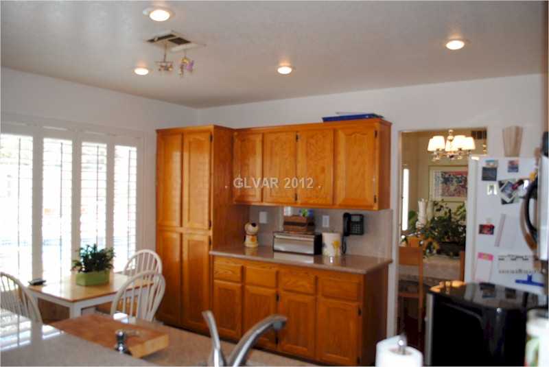 22 Rue De Parc Henderson, NV 89074 - Photo 10 of 32 Kitchen. Storage space a plenty, granite countertops, pantry, shutters, and eat-in space complete the kitchen.