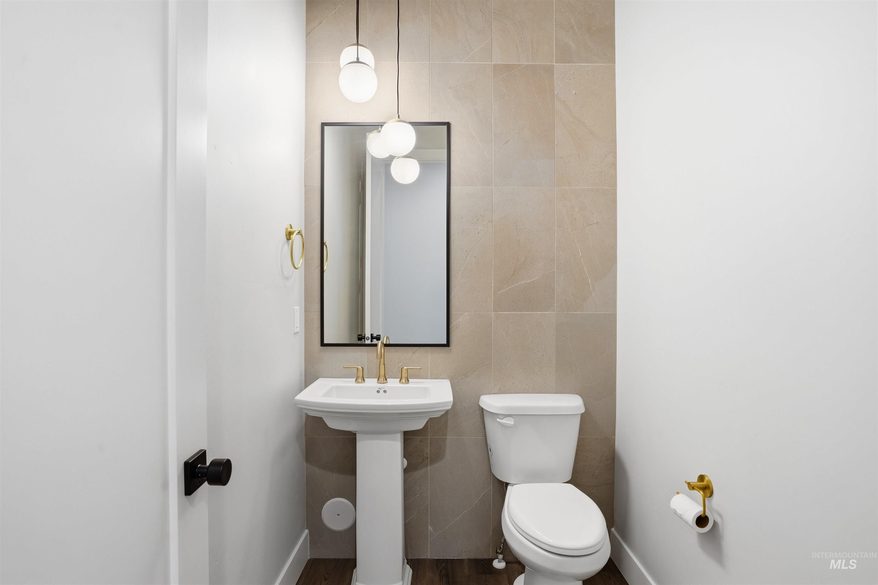 2976 East Parulo Drive Meridian, ID 83642 - Photo 24 of 40 Bathroom featuring tile walls and toilet