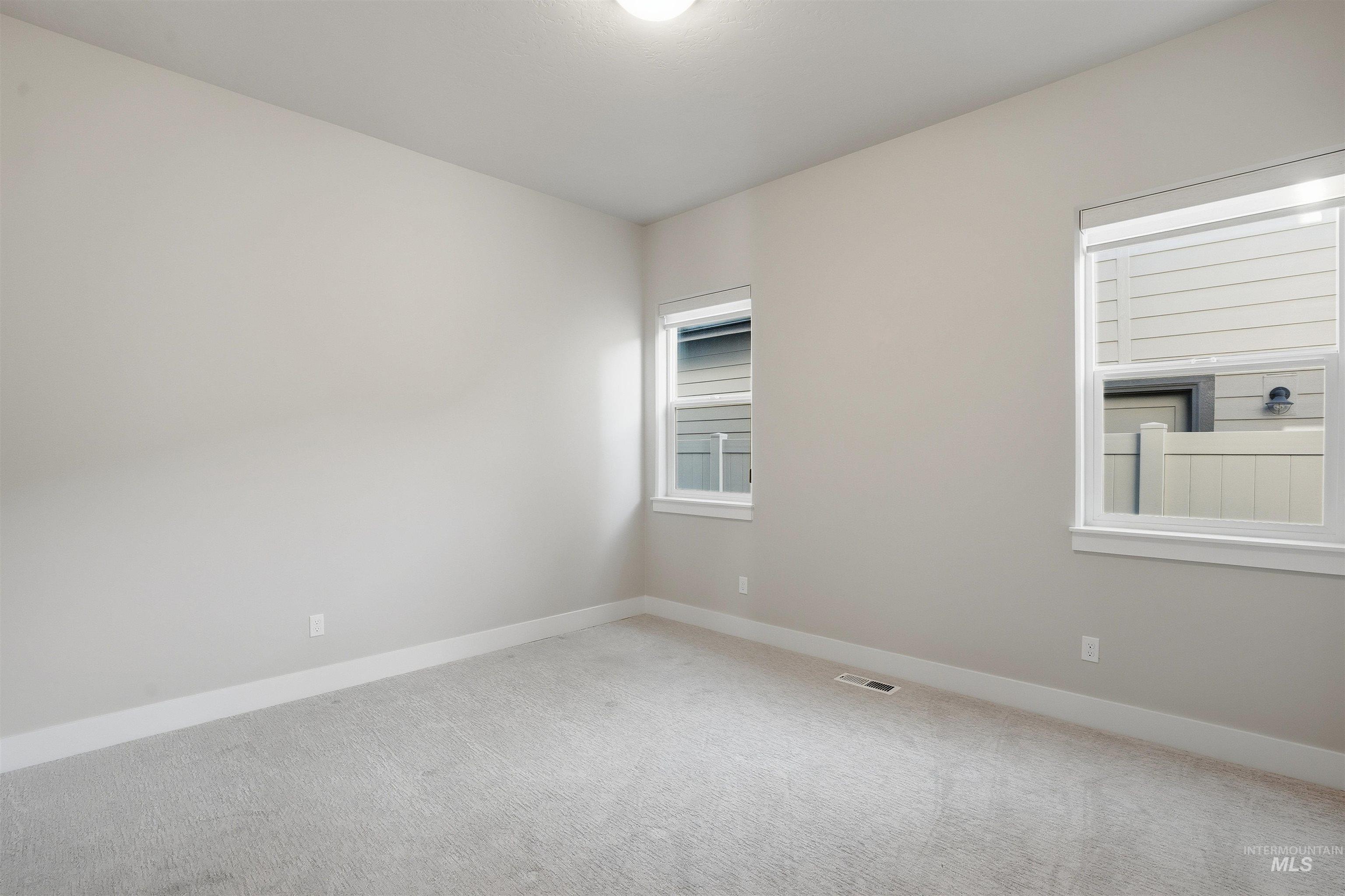 2976 East Parulo Drive Meridian, ID 83642 - Photo 27 of 40 Empty room featuring baseboards and carpet