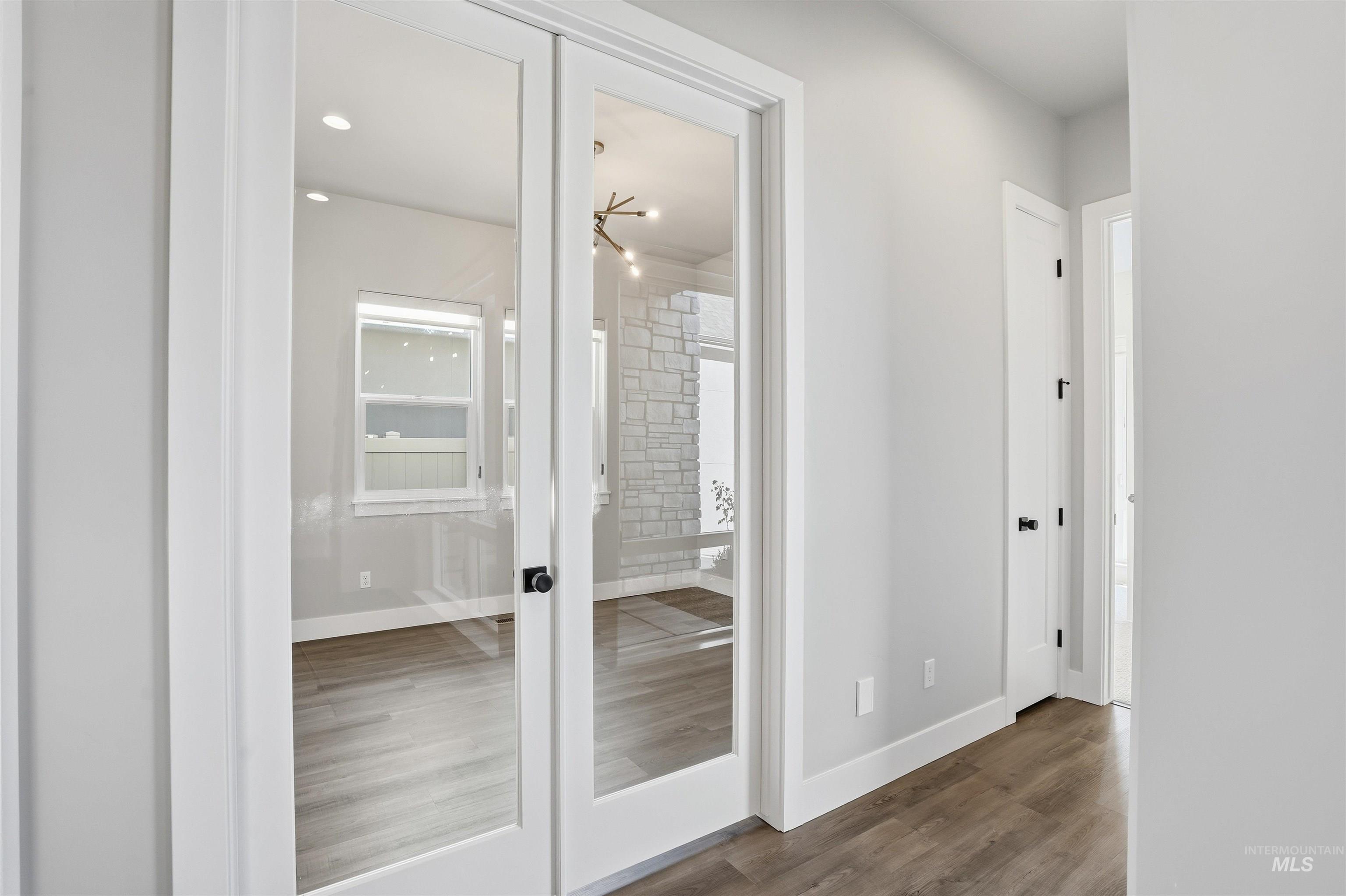 2976 East Parulo Drive Meridian, ID 83642 - Photo 30 of 40 Corridor featuring french doors and dark wood-style floors