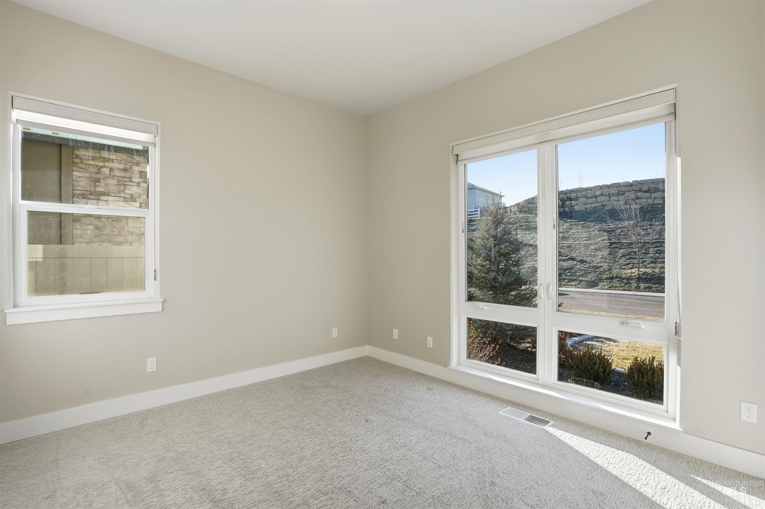 2976 East Parulo Drive Meridian, ID 83642 - Photo 32 of 40 Carpeted spare room with baseboards