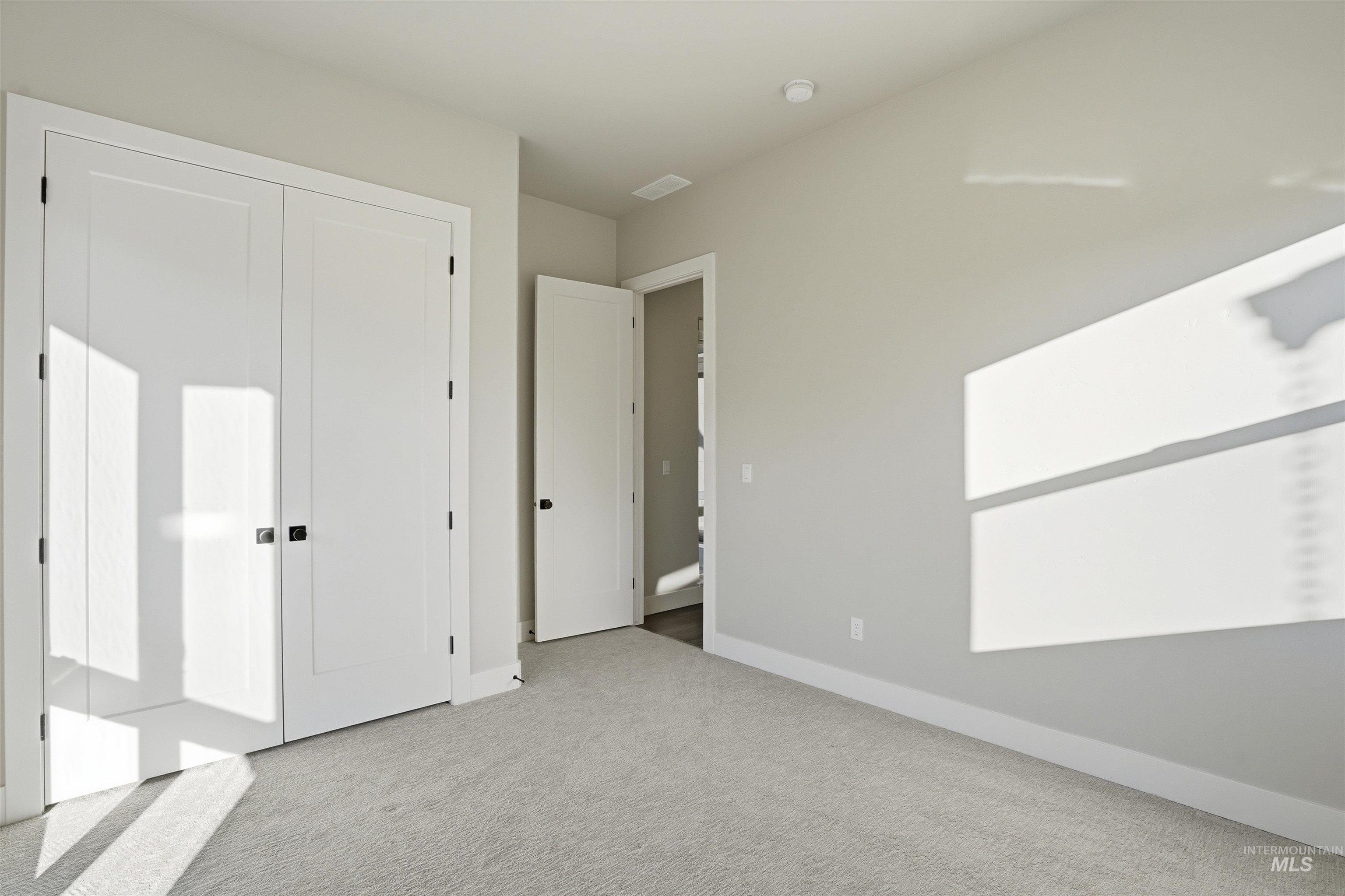 2976 East Parulo Drive Meridian, ID 83642 - Photo 33 of 40 Unfurnished bedroom with carpet flooring and a closet
