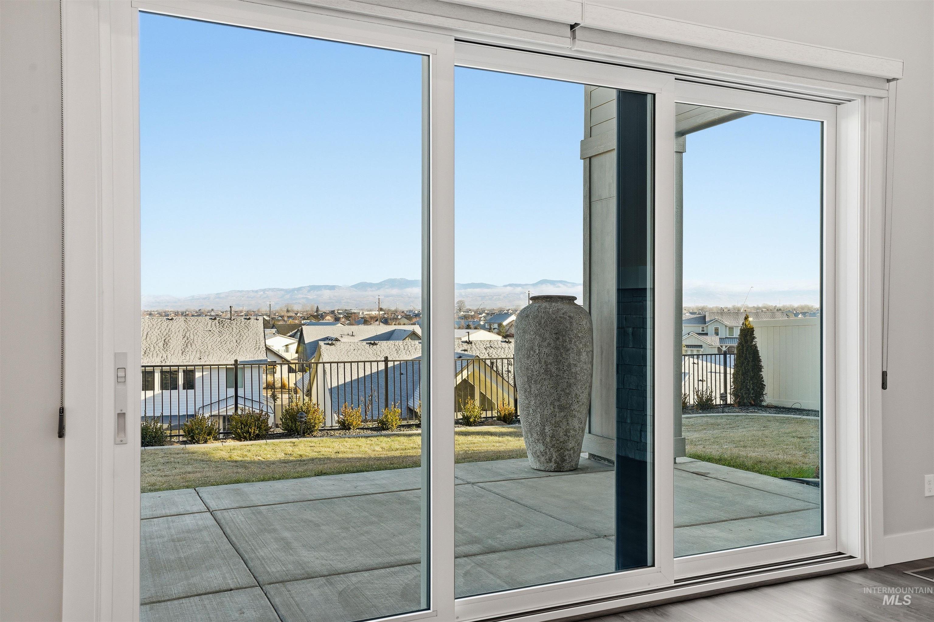 2976 East Parulo Drive Meridian, ID 83642 - Photo 34 of 40 Doorway to outside featuring a residential view