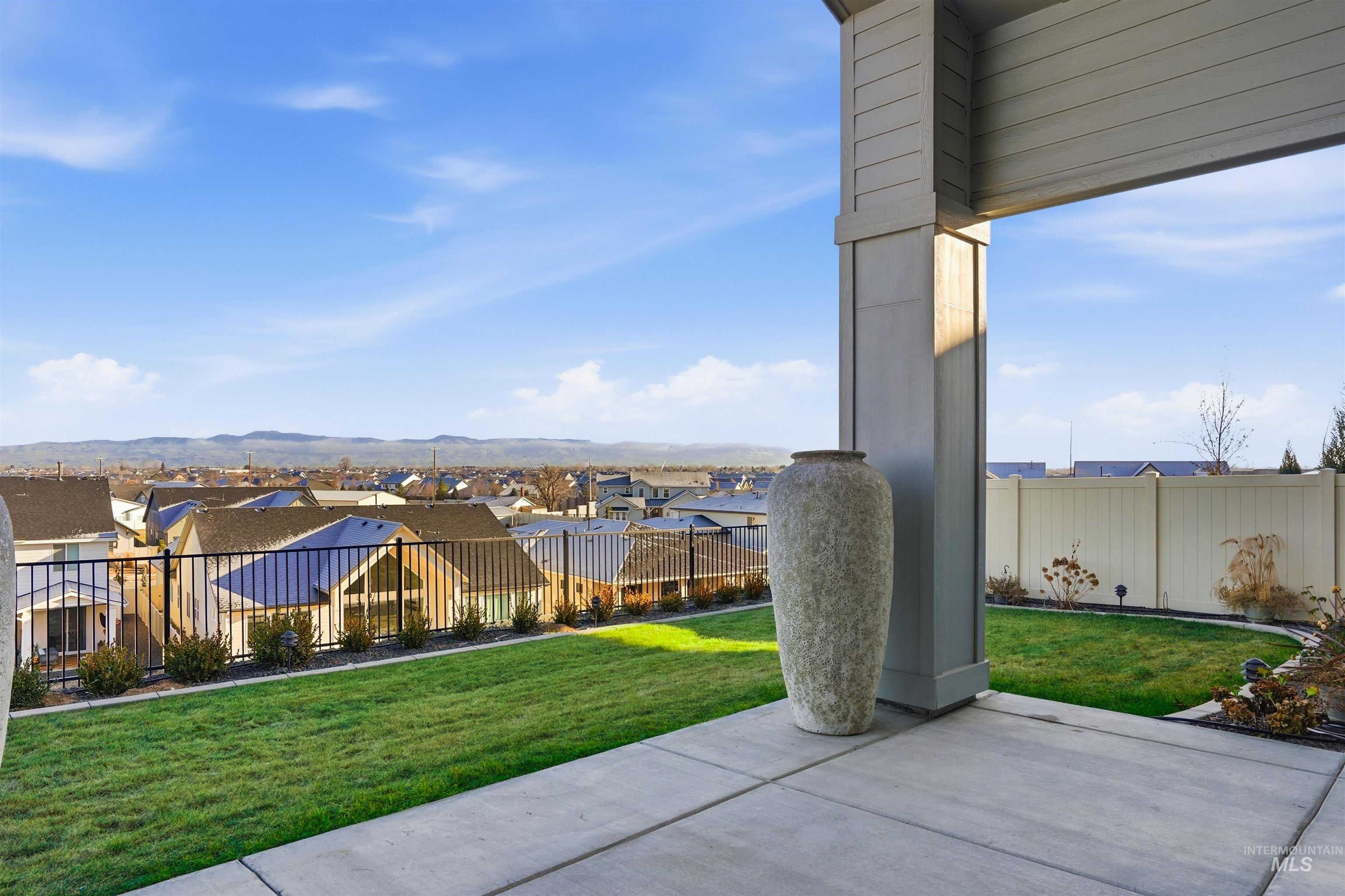2976 East Parulo Drive Meridian, ID 83642 - Photo 36 of 40 View of patio / terrace with a residential view and a mountain view