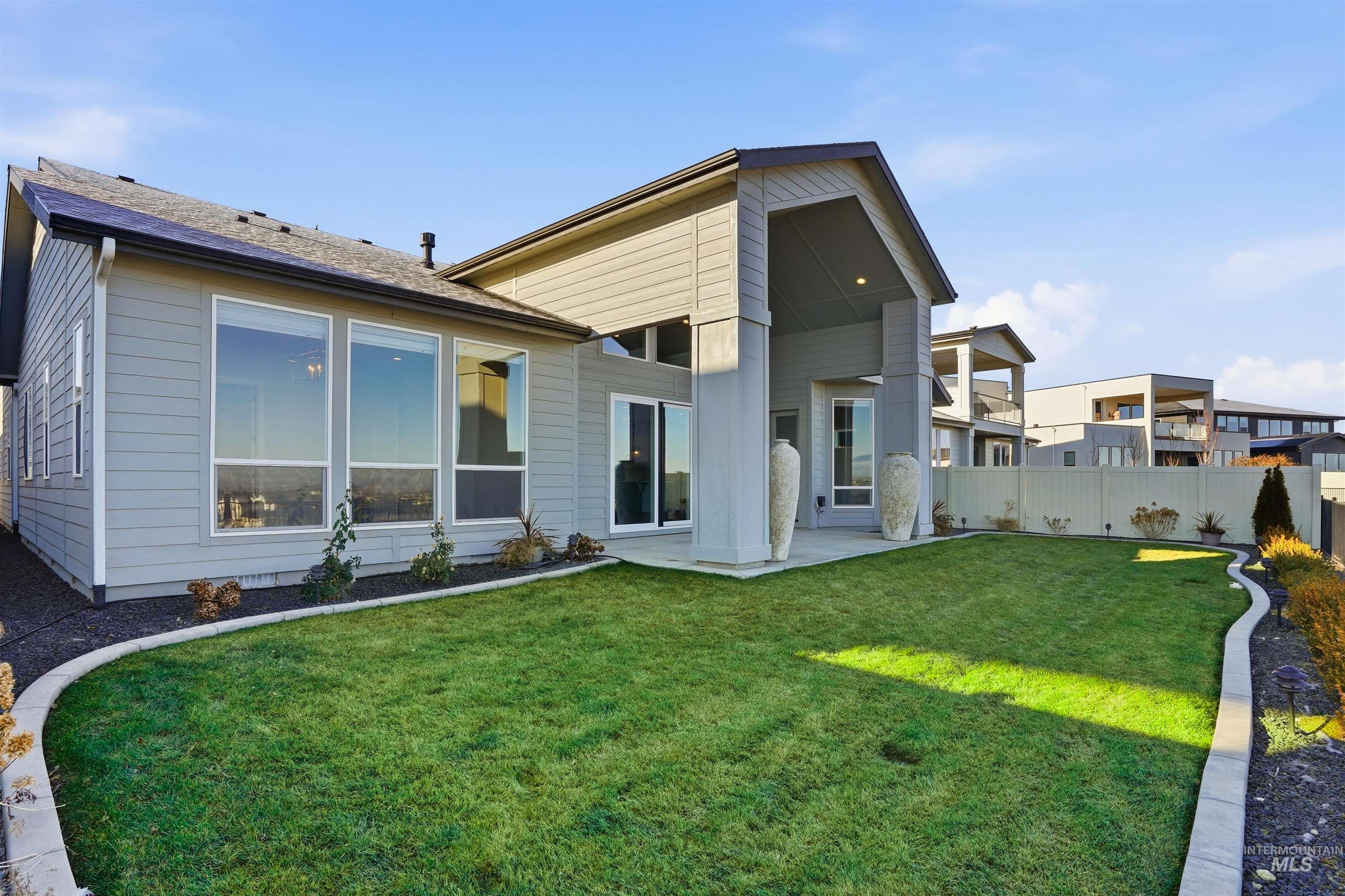 2976 East Parulo Drive Meridian, ID 83642 - Photo 38 of 40 Rear view of house featuring a fenced backyard and a patio