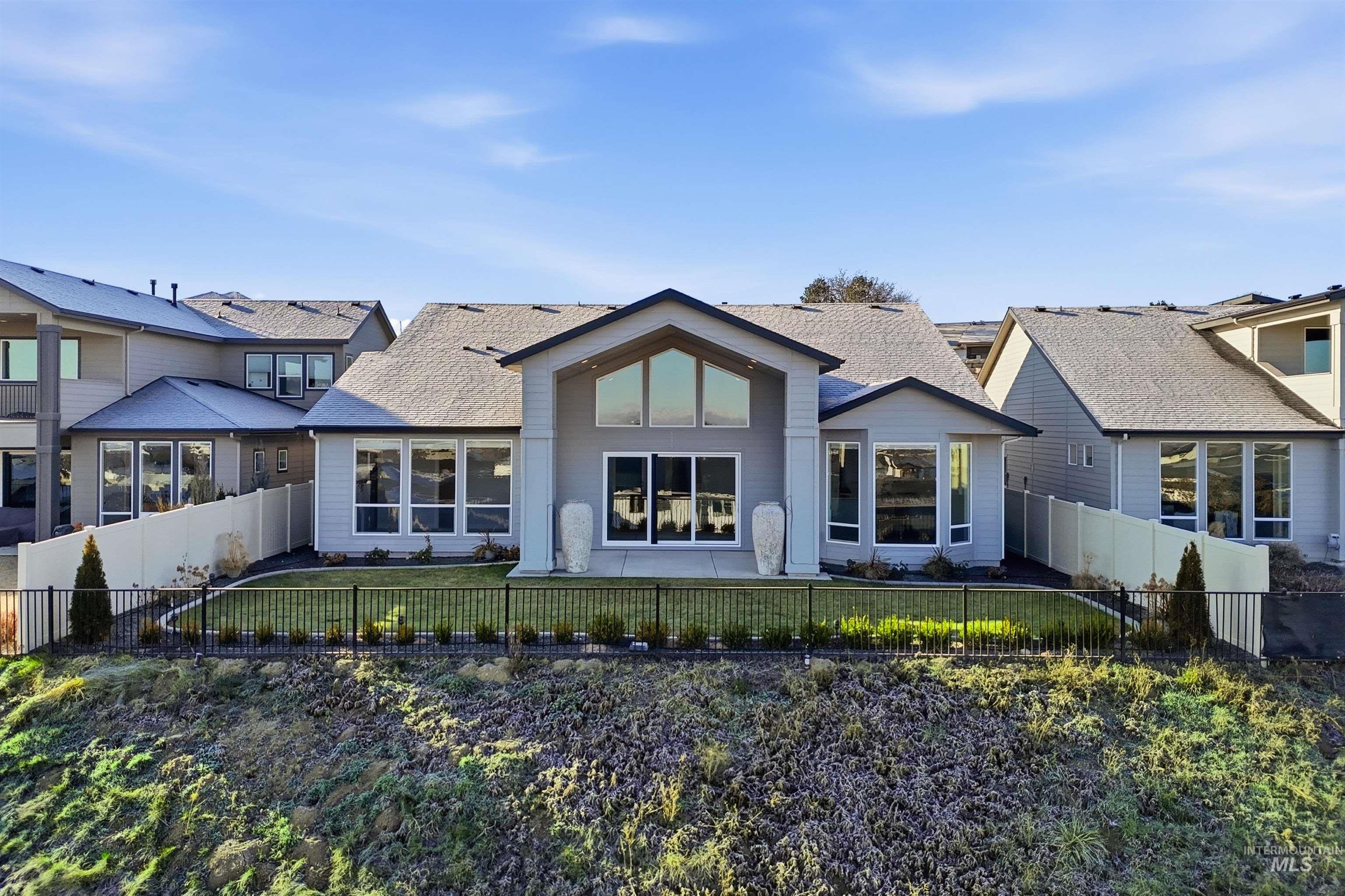 2976 East Parulo Drive Meridian, ID 83642 - Photo 39 of 40 Back of property featuring a fenced backyard and a shingled roof