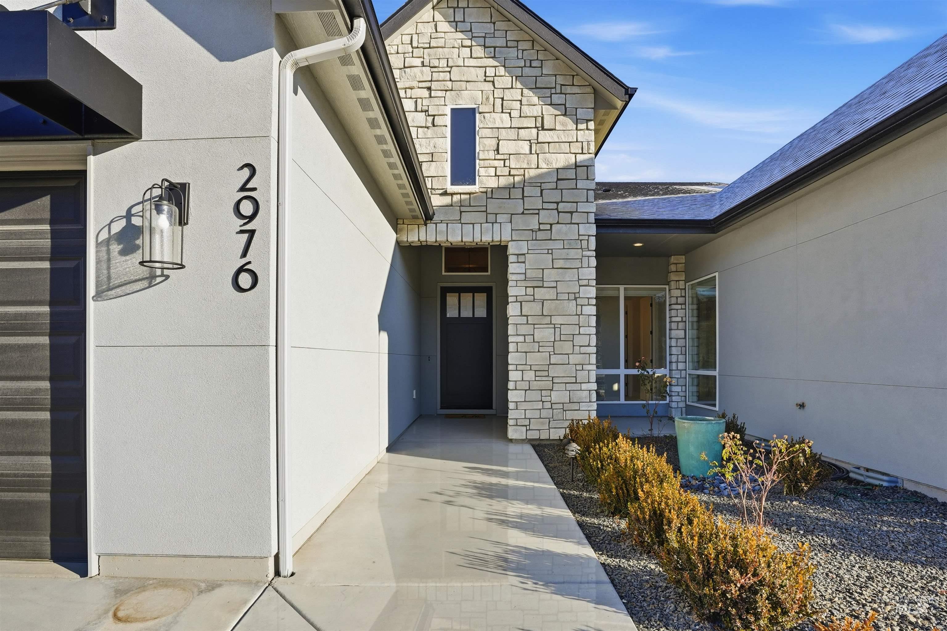 2976 East Parulo Drive Meridian, ID 83642 - Photo 4 of 40 Property entrance featuring stone siding and stucco siding