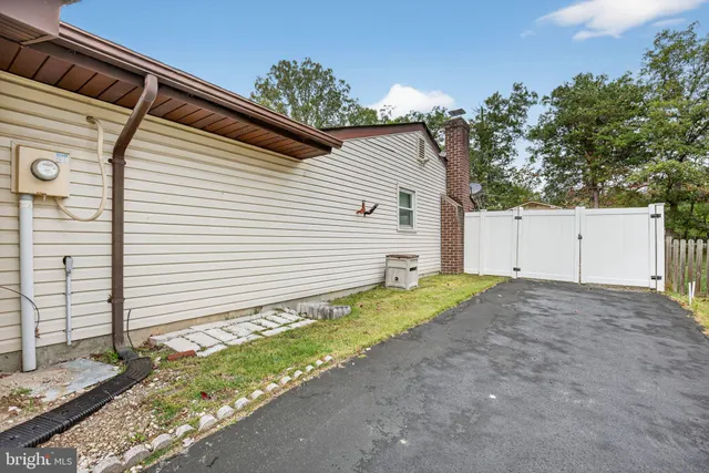 a view of backyard with a barn and a cactus plant