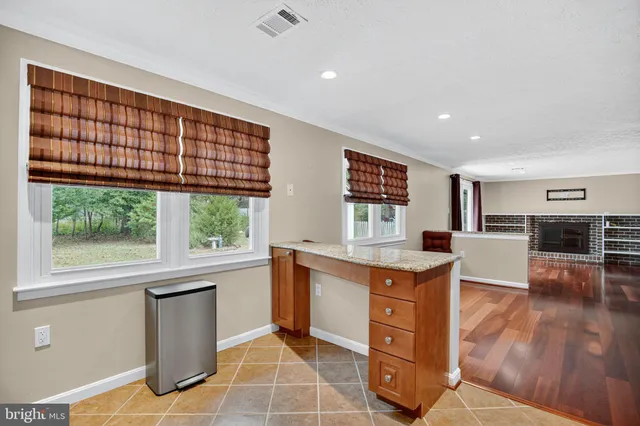 a kitchen with stainless steel appliances granite countertop a stove and a sink