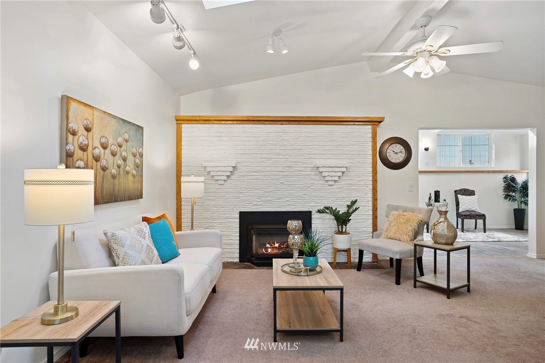 17415 Renton Issaquah Road Southeast Renton, WA 98059 - Photo 14 of 37 a living room with furniture and a fireplace