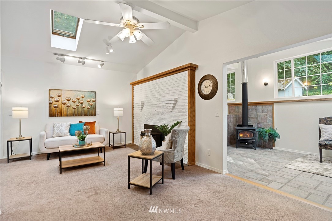 17415 Renton Issaquah Road Southeast Renton, WA 98059 - Photo 15 of 37 a living room with furniture and a clock