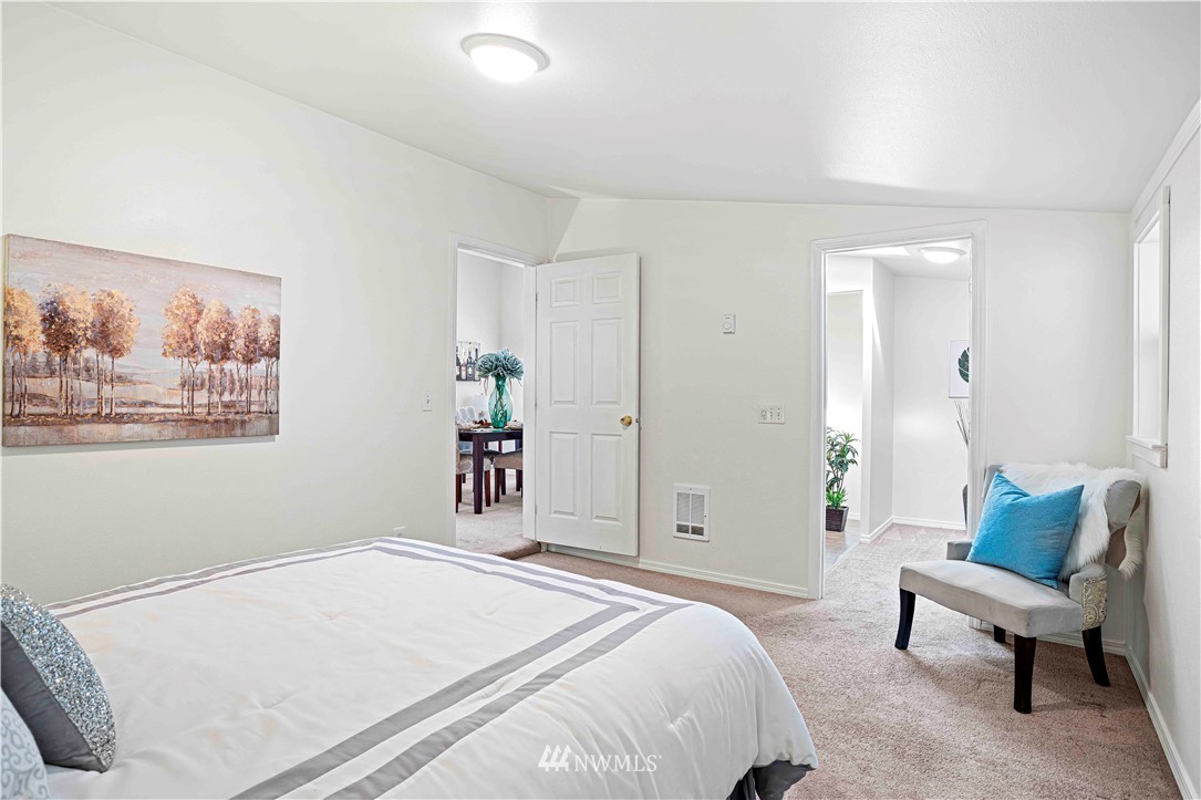 17415 Renton Issaquah Road Southeast Renton, WA 98059 - Photo 23 of 37 a bedroom with a bed and a painting on the wall