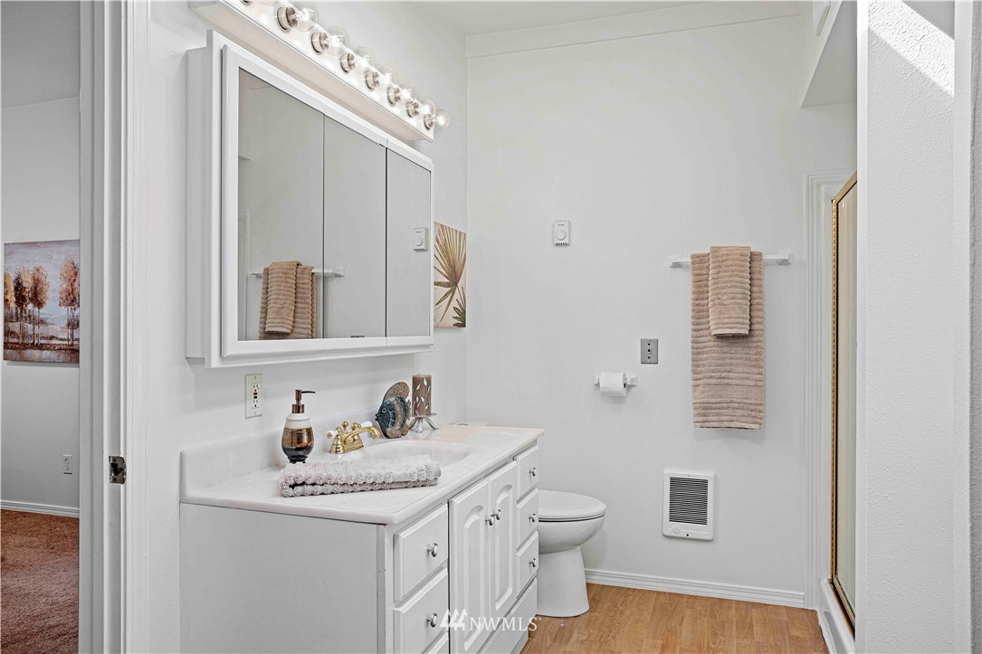 17415 Renton Issaquah Road Southeast Renton, WA 98059 - Photo 24 of 37 a bathroom with a sink toilet and mirror