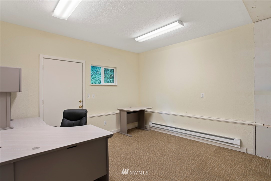 17415 Renton Issaquah Road Southeast Renton, WA 98059 - Photo 26 of 37 a bedroom with a bed and a desk