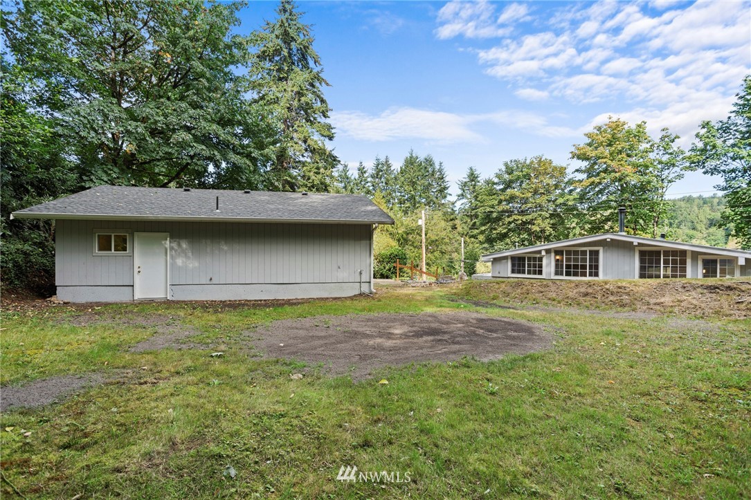 17415 Renton Issaquah Road Southeast Renton, WA 98059 - Photo 32 of 37 a front view of a house with a garden