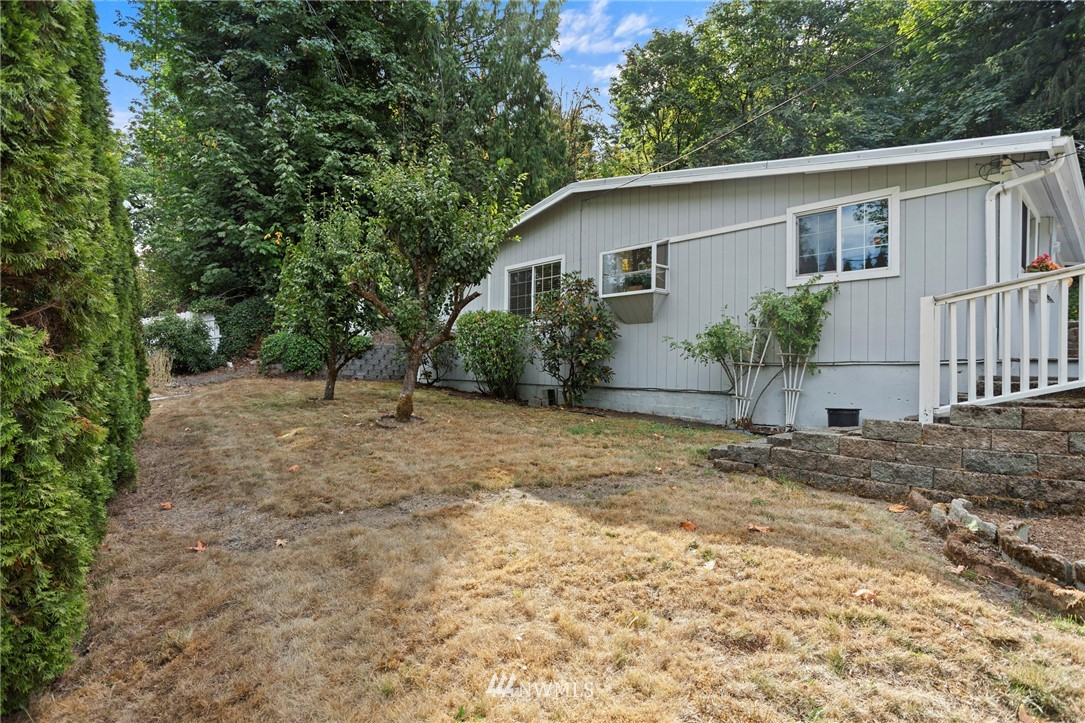 17415 Renton Issaquah Road Southeast Renton, WA 98059 - Photo 35 of 37 a view of a house with a yard