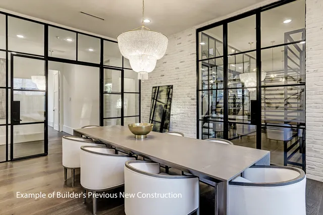 a kitchen with a table chairs and wooden floor