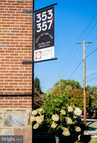 a sign that is on a brick wall