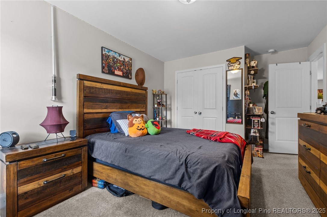 160 Huzzas Circle Cameron, NC 28326 - Photo 16 of 34 a bedroom with a bed and a window
