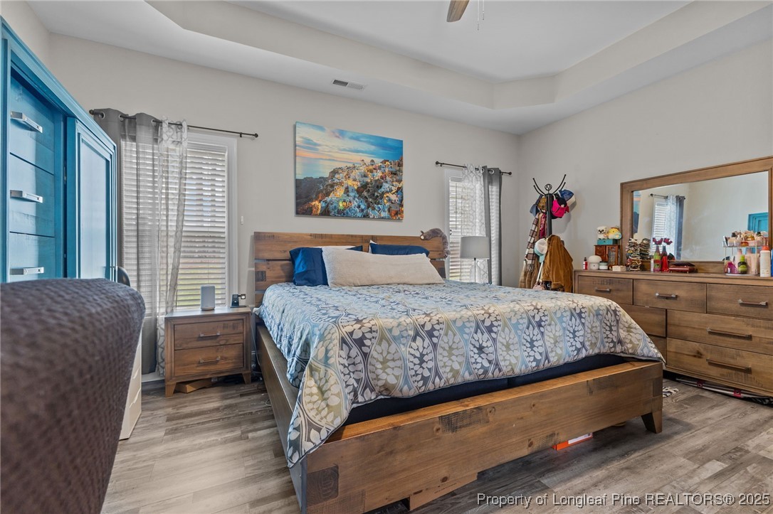 160 Huzzas Circle Cameron, NC 28326 - Photo 18 of 34 a bedroom with a bed and a couch