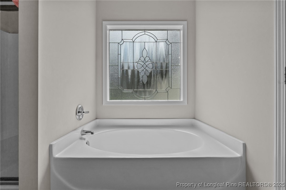160 Huzzas Circle Cameron, NC 28326 - Photo 20 of 34 a white bath tub sitting next to a shower