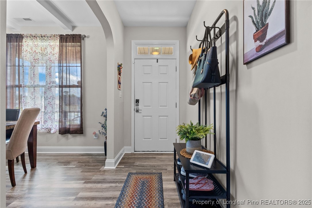 160 Huzzas Circle Cameron, NC 28326 - Photo 22 of 34 a living room with furniture and a potted plant