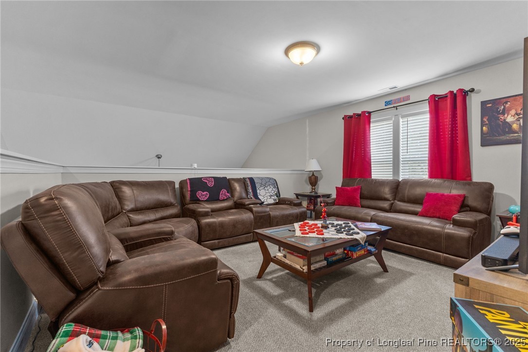 160 Huzzas Circle Cameron, NC 28326 - Photo 24 of 34 a living room with furniture and a large window