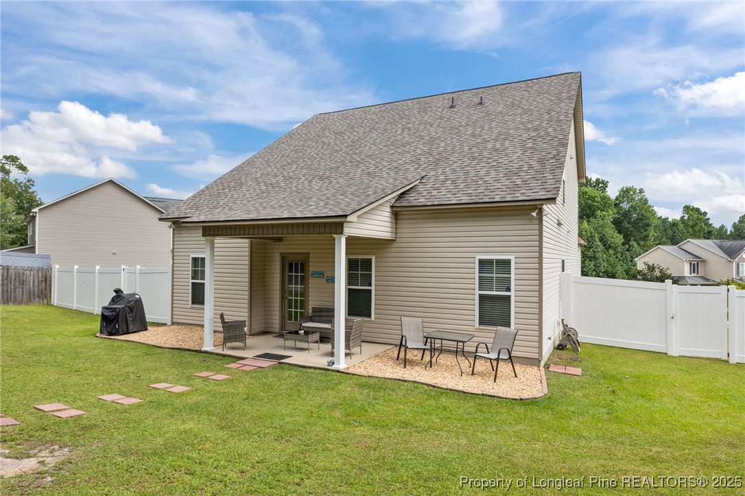 160 Huzzas Circle Cameron, NC 28326 - Photo 26 of 34 a view of a house with backyard porch and garden