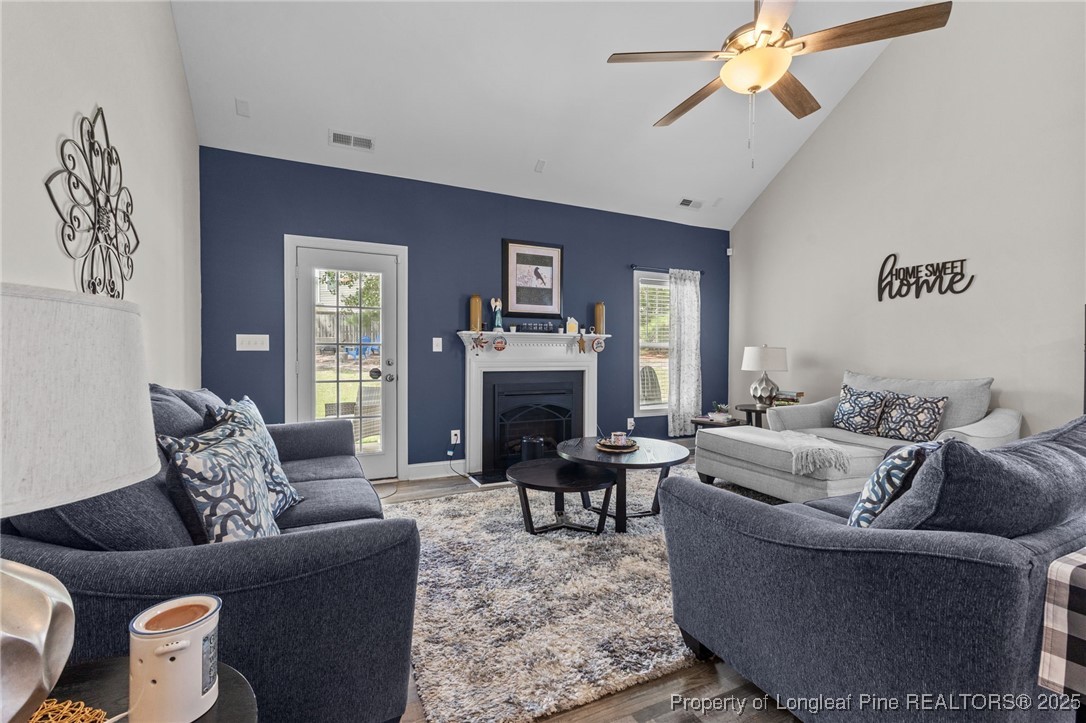 160 Huzzas Circle Cameron, NC 28326 - Photo 8 of 34 a living room with furniture and a fireplace