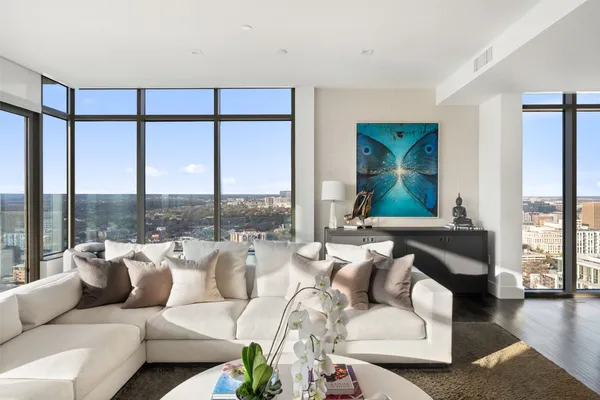 a living room with furniture and a large window