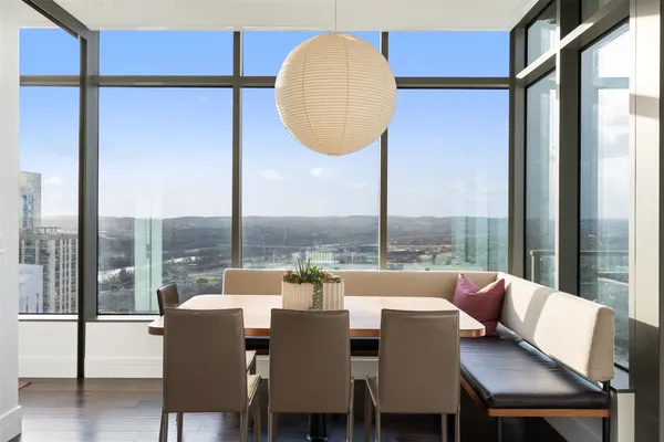 a view of a dining room with furniture window and outside view