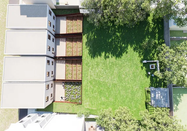 an aerial view of house with yard and seating space