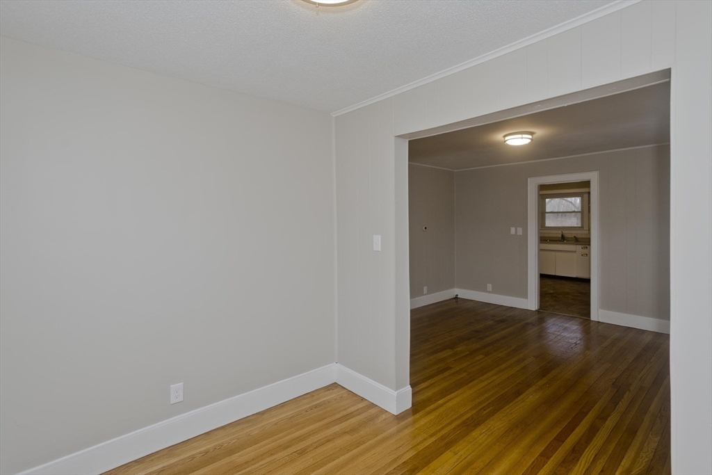 177 Marion Street Chicopee, MA 01013 - Photo 27 of 36 a view of an empty room with wooden floor