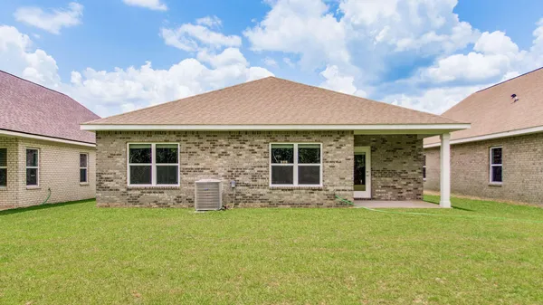 a front view of house with yard outdoor seating and porch
