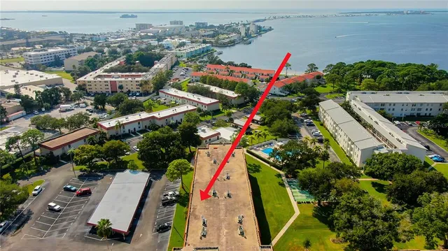 a living room with furniture and a mirror