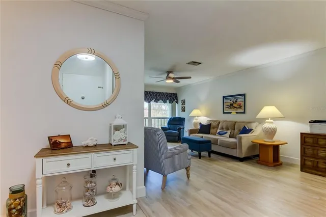 a bedroom with a bed next to a window