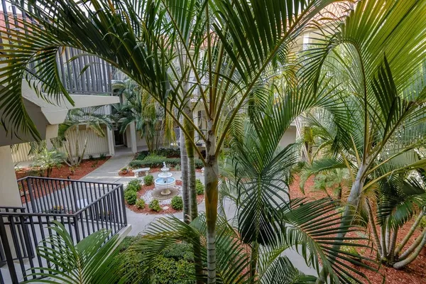 an aerial view of a house with a garden and deck