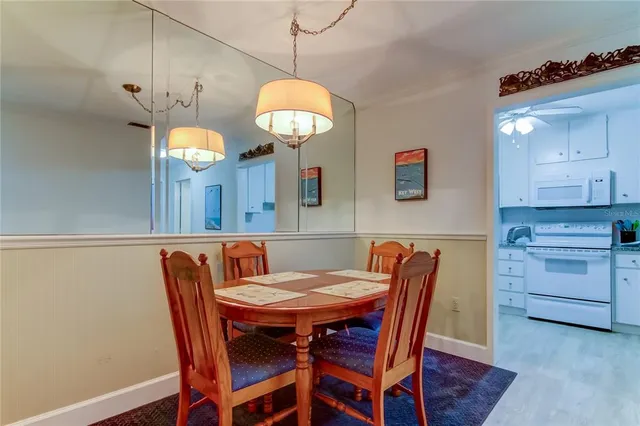 a bathroom with a toilet and a picture on the wall