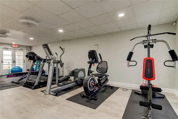 a view of tree in front of a yard