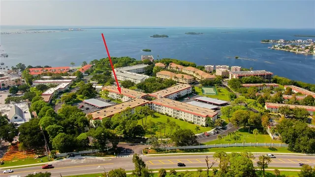an aerial view of house with a yard and mountain