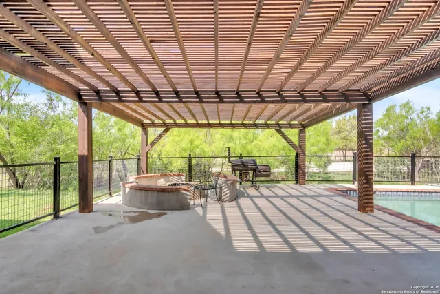 a view of a house with a swimming pool and a yard