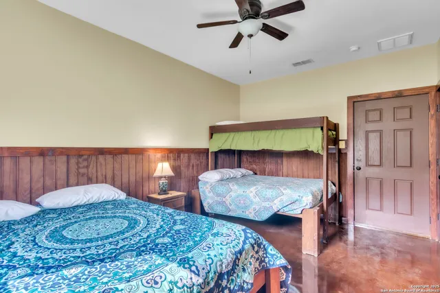 a bathroom with a sink a toilet a mirror and shower