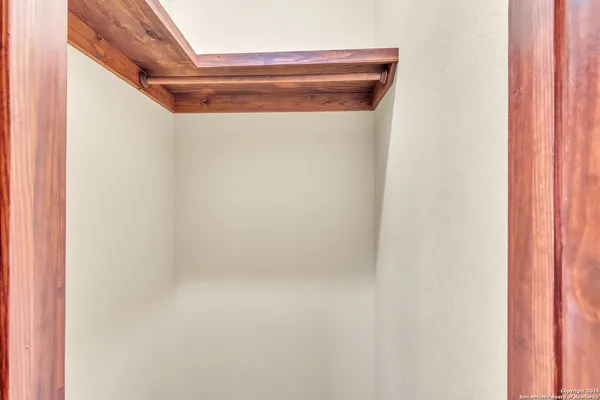 a bathroom with a sink vanity granite and a mirror