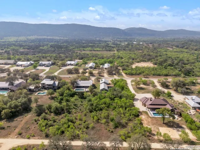 an aerial view of a house with a garden