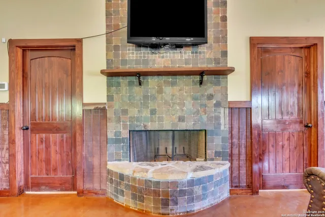 a room with fireplace and flat screen tv