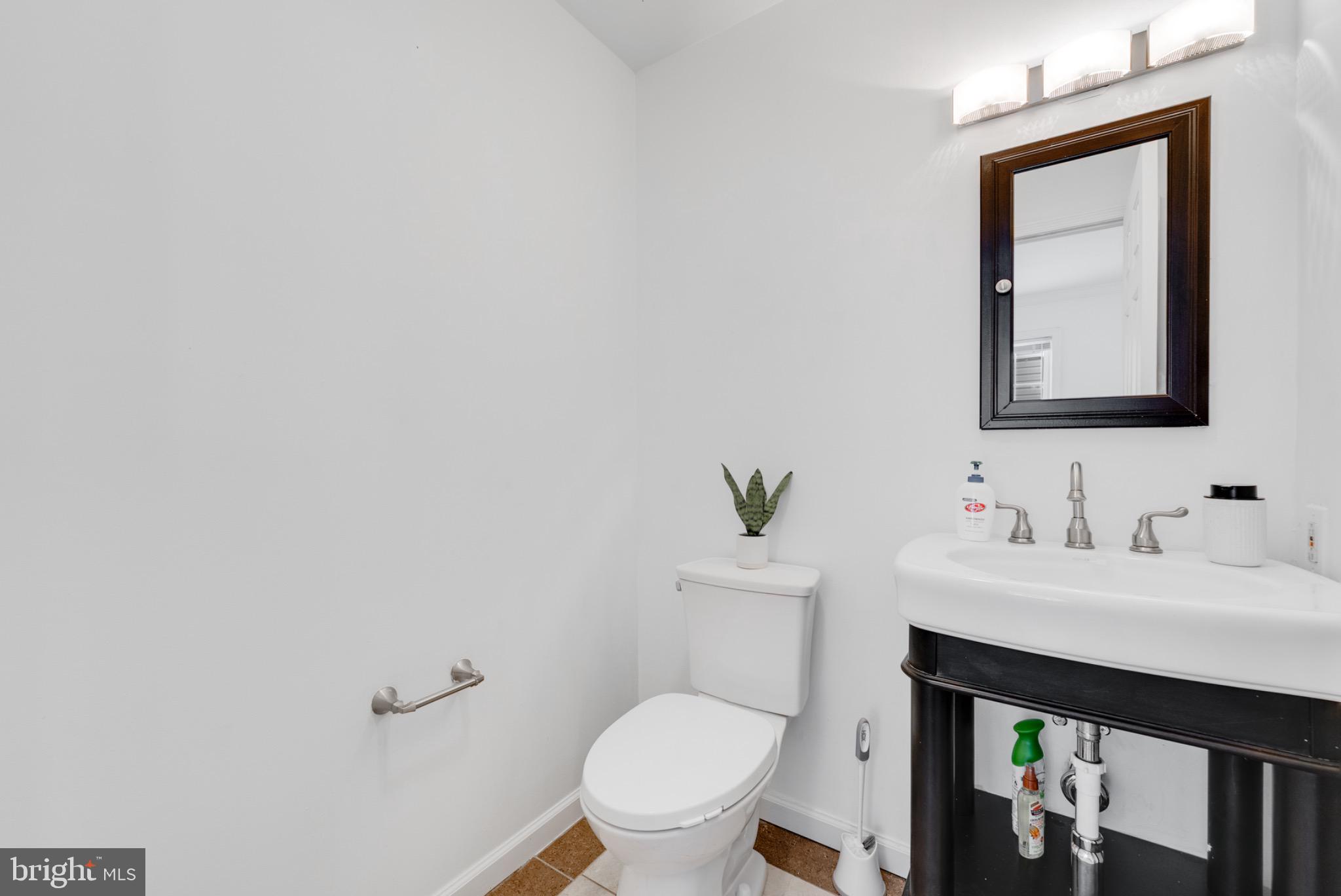 2 Knox Circle Southeast Washington, DC 20020 - Photo 14 of 25 a bathroom with a toilet a sink and mirror
