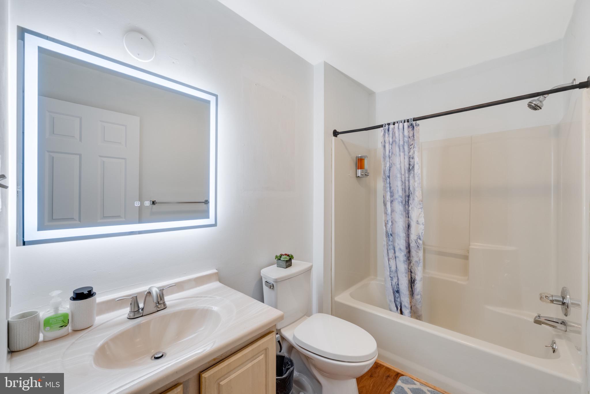 2 Knox Circle Southeast Washington, DC 20020 - Photo 19 of 25 a bathroom with a sink toilet and shower