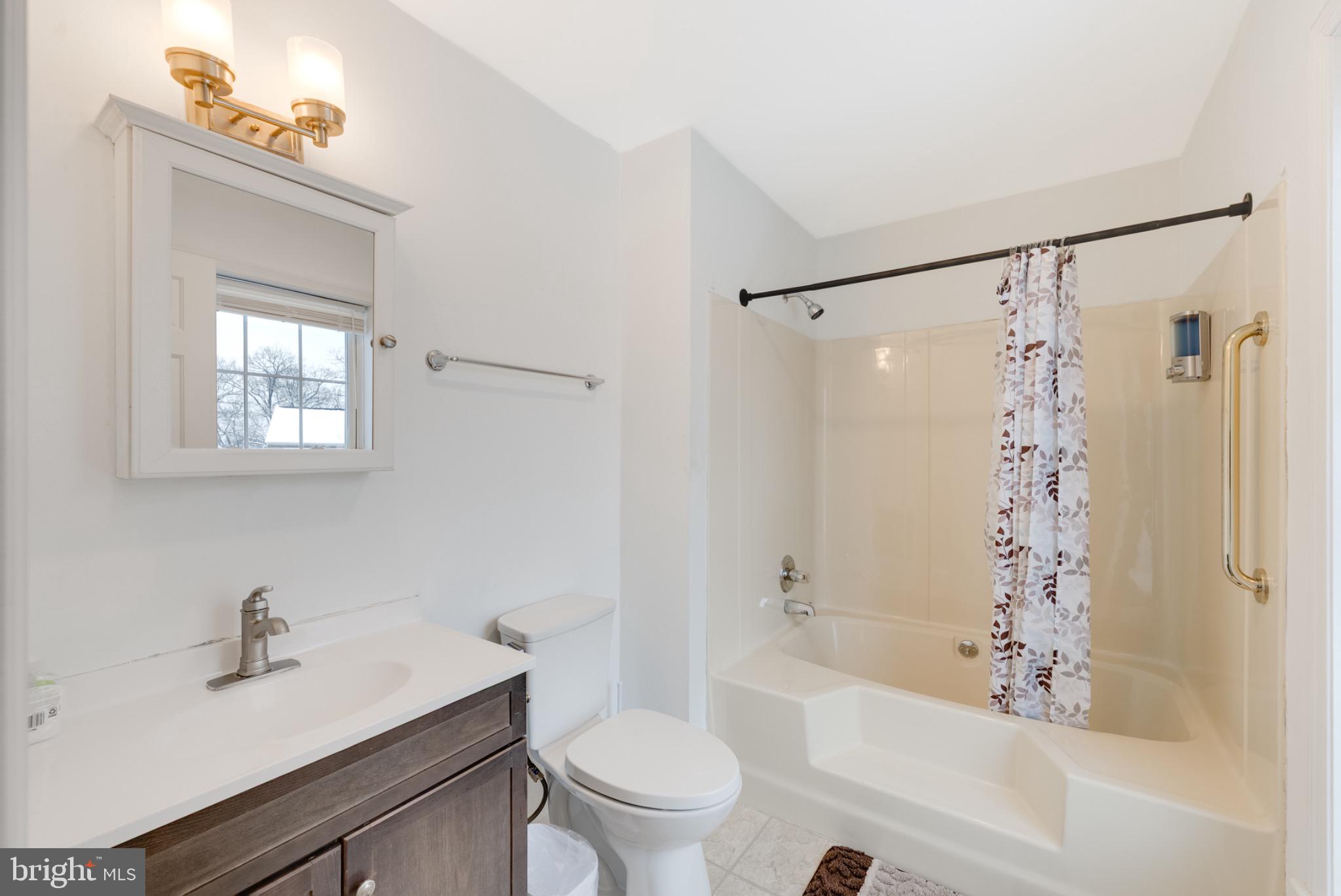 2 Knox Circle Southeast Washington, DC 20020 - Photo 22 of 25 a white bath tub sitting next to a white toilet