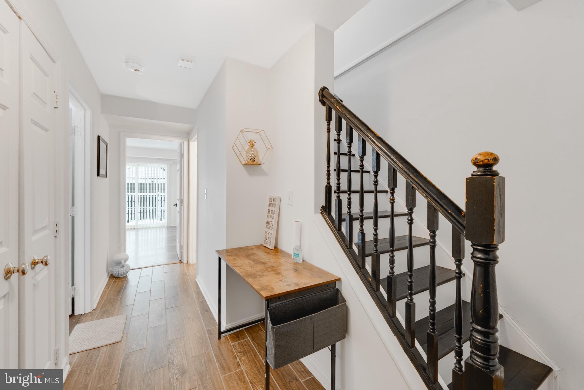 2 Knox Circle Southeast Washington, DC 20020 - Photo 3 of 25 a view of an entryway with wooden floor and stairs