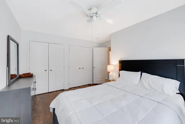 a bedroom with a bed and a walk in closet